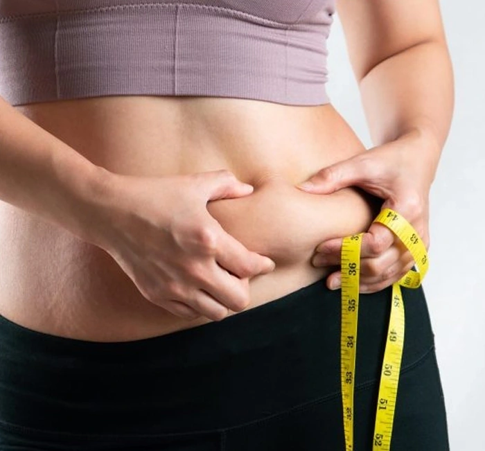 A tape measure around a waist